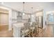 Bright kitchen features stainless steel appliances, center island with bar seating, and designer finishes at 2652 Private Lefler Dr, Johns Island, SC 29455