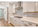 Modern kitchen with white cabinets, stainless steel appliances, and a gas range at 2652 Private Lefler Dr, Johns Island, SC 29455