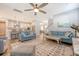 Open-concept living room flowing into kitchen, featuring hardwood floors and comfortable seating at 2652 Private Lefler Dr, Johns Island, SC 29455