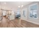 Open living space with hardwood floors flows from kitchen to living room with lots of natural light at 2652 Private Lefler Dr, Johns Island, SC 29455