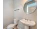 Modern powder room featuring a pedestal sink, sleek fixtures, and a clean, minimalist design at 2652 Private Lefler Dr, Johns Island, SC 29455