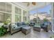 Inviting screened porch with comfortable furniture, offering a relaxing outdoor living space at 2652 Private Lefler Dr, Johns Island, SC 29455
