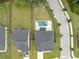 Aerial view of home and backyard with pool and jacuzzi in fenced in yard with sidewalk and street at 2802 Cavalcade Cir, Johns Island, SC 29455