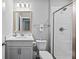 Bright bathroom featuring a shower with glass doors, a vanity, and a toilet at 2802 Cavalcade Cir, Johns Island, SC 29455