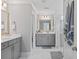 Bathroom featuring double sink vanity with walk-in shower and updated tile and fixtures at 2802 Cavalcade Cir, Johns Island, SC 29455