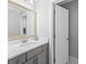 Bright bathroom featuring a vanity with a quartz countertop, a mirror, and a modern faucet at 2802 Cavalcade Cir, Johns Island, SC 29455