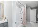 Clean bathroom with subway tile shower, new fixtures, and a palm tree-themed shower curtain at 2802 Cavalcade Cir, Johns Island, SC 29455