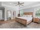 Bedroom boasts hard floors, a tray ceiling, ceiling fan and an area rug at 2802 Cavalcade Cir, Johns Island, SC 29455