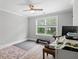 Bright bedroom featuring wood flooring, ceiling fan, large window and crown moulding at 2802 Cavalcade Cir, Johns Island, SC 29455