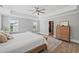 Spacious bedroom with tray ceiling, ceiling fan, carpet, large windows and walk-in closet at 2802 Cavalcade Cir, Johns Island, SC 29455