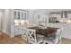 Dining area with a wooden table, seating for six, and built-in cabinets at 2802 Cavalcade Cir, Johns Island, SC 29455
