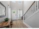 Inviting foyer with soaring ceilings, wood floors, and a staircase leading to upper level at 2802 Cavalcade Cir, Johns Island, SC 29455