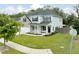 Charming two-story home featuring a two-car garage, landscaped yard, sidewalk and welcoming front porch at 2802 Cavalcade Cir, Johns Island, SC 29455