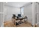 Well-lit office with wood floors, wainscotting, and a large window for a bright and inviting workspace at 2802 Cavalcade Cir, Johns Island, SC 29455