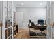 The office features French doors, wood floors, and wainscotting creating a private and stylish workspace at 2802 Cavalcade Cir, Johns Island, SC 29455