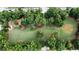 Breathtaking aerial view showcasing a vast green space with lush trees, seating, and manicured lawns at 2820 Merriams Dr, Charleston, SC 29414