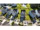 An aerial view of a tranquil neighborhood featuring lovely homes, palm trees, and a peaceful pond at 2820 Merriams Dr, Charleston, SC 29414