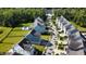 An aerial perspective of charming homes, palm-lined streets, and lush greenery in a vibrant community at 2820 Merriams Dr, Charleston, SC 29414
