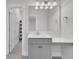 Bright bathroom with vanity and a mirror with decorative lighting, plus an adjacent toilet and shower at 2820 Merriams Dr, Charleston, SC 29414