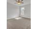 Spacious bedroom with white walls, carpet flooring, a ceiling fan, and a large window at 2820 Merriams Dr, Charleston, SC 29414
