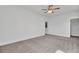 Open bedroom with neutral carpet, ceiling fan, white trim, and doorways to other rooms at 2820 Merriams Dr, Charleston, SC 29414