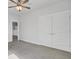 Spacious bedroom with neutral carpet, a ceiling fan, and double door closet at 2820 Merriams Dr, Charleston, SC 29414