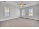Spacious bedroom with three windows and a ceiling fan provides natural light and air flow at 2820 Merriams Dr, Charleston, SC 29414