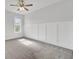 Bright bedroom with neutral carpet, board and batten trim and large window offering plenty of light at 2820 Merriams Dr, Charleston, SC 29414