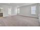 Large bedroom with neutral carpet, great natural light, and access to ensuite bathroom at 2820 Merriams Dr, Charleston, SC 29414