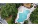 Beautiful aerial shot of community pool with lounge chairs, umbrellas, and surrounded by lush greenery at 2820 Merriams Dr, Charleston, SC 29414