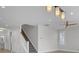 Foyer featuring a staircase with wood and white trim and modern lighting at 2820 Merriams Dr, Charleston, SC 29414