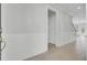 Bright entryway featuring hardwood floors, wainscoting, and a glimpse of the staircase to the next level at 2820 Merriams Dr, Charleston, SC 29414