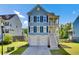 Charming two-story home with a driveway, garage, and a welcoming front porch under a blue sky at 2820 Merriams Dr, Charleston, SC 29414