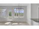 Bright kitchen area with modern lighting, island, and plenty of windows bringing in natural light to cook at 2820 Merriams Dr, Charleston, SC 29414