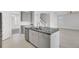 Open concept kitchen with gray cabinets, granite countertops, and center island at 2820 Merriams Dr, Charleston, SC 29414