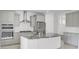 Modern kitchen with gray cabinets, stainless steel appliances, and a large granite island at 2820 Merriams Dr, Charleston, SC 29414