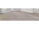 Spacious living room with clean carpet and plenty of natural light, perfect for relaxing at 2820 Merriams Dr, Charleston, SC 29414