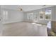 Bright living room with light-colored flooring, many windows, and modern light fixtures at 2820 Merriams Dr, Charleston, SC 29414