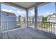 Charming covered porch with wooden floors offering neighborhood views, perfect for outdoor living at 2820 Merriams Dr, Charleston, SC 29414