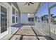Relaxing screened-in porch features a ceiling fan and attractive outdoor rugs for comfort and style at 2820 Merriams Dr, Charleston, SC 29414