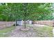 Fenced backyard with mature tree, brick-paver patio and two storage sheds. Relax and enjoy the outdoors at 3009 Mapleleaf Dr, Moncks Corner, SC 29461