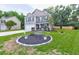 Charming two-story home with green shutters, a manicured lawn, and a decorative front yard at 3009 Mapleleaf Dr, Moncks Corner, SC 29461