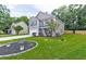 Charming two-story home with green shutters, manicured lawn, and landscaped garden beds. Includes attached garage and concrete driveway at 3009 Mapleleaf Dr, Moncks Corner, SC 29461