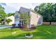 Beautiful two-story home featuring a well-manicured lawn, neat landscaping, and a tidy, inviting front yard at 3009 Mapleleaf Dr, Moncks Corner, SC 29461