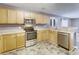 Well-lit kitchen boasts stainless appliances, wood cabinets, and modern countertops at 3009 Mapleleaf Dr, Moncks Corner, SC 29461