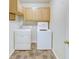 Convenient laundry room with washer, dryer, and cabinet storage at 3009 Mapleleaf Dr, Moncks Corner, SC 29461