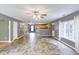 Open living room with wood floors flows into the kitchen area, which has matching wood cabinets at 3009 Mapleleaf Dr, Moncks Corner, SC 29461