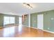 Large living room features wood floors, neutral paint, staircase, and a bright, sunny window at 3009 Mapleleaf Dr, Moncks Corner, SC 29461