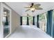 Enjoy this covered patio with ceiling fans and curtains for outdoor relaxation at 3009 Mapleleaf Dr, Moncks Corner, SC 29461
