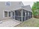 The home features a screened-in porch with curtains, brick flooring, and an adjacent patio at 3009 Mapleleaf Dr, Moncks Corner, SC 29461